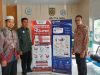 Diskominfotik Banda Aceh Distribusikan 58 Roll Banner SP4N-LAPOR dan PPID.
